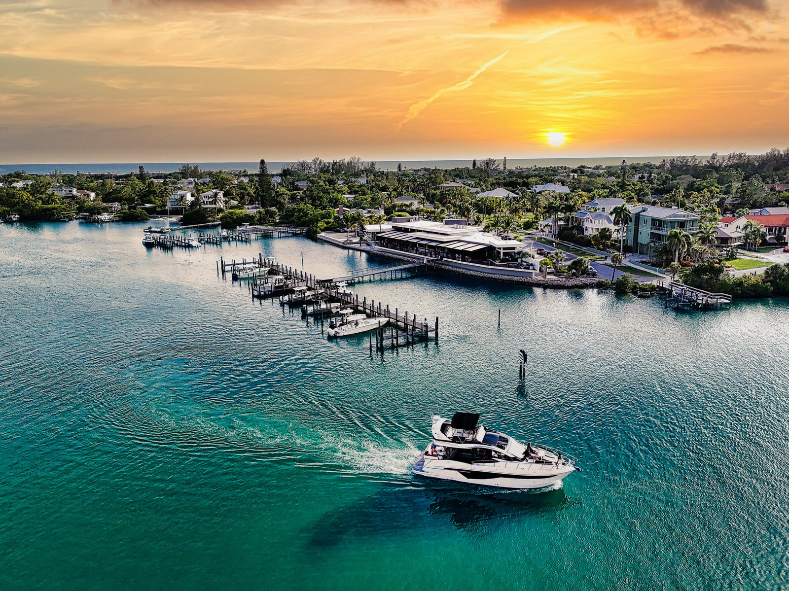 Good Vibes running through turquoise water at sunset off the Florida coast