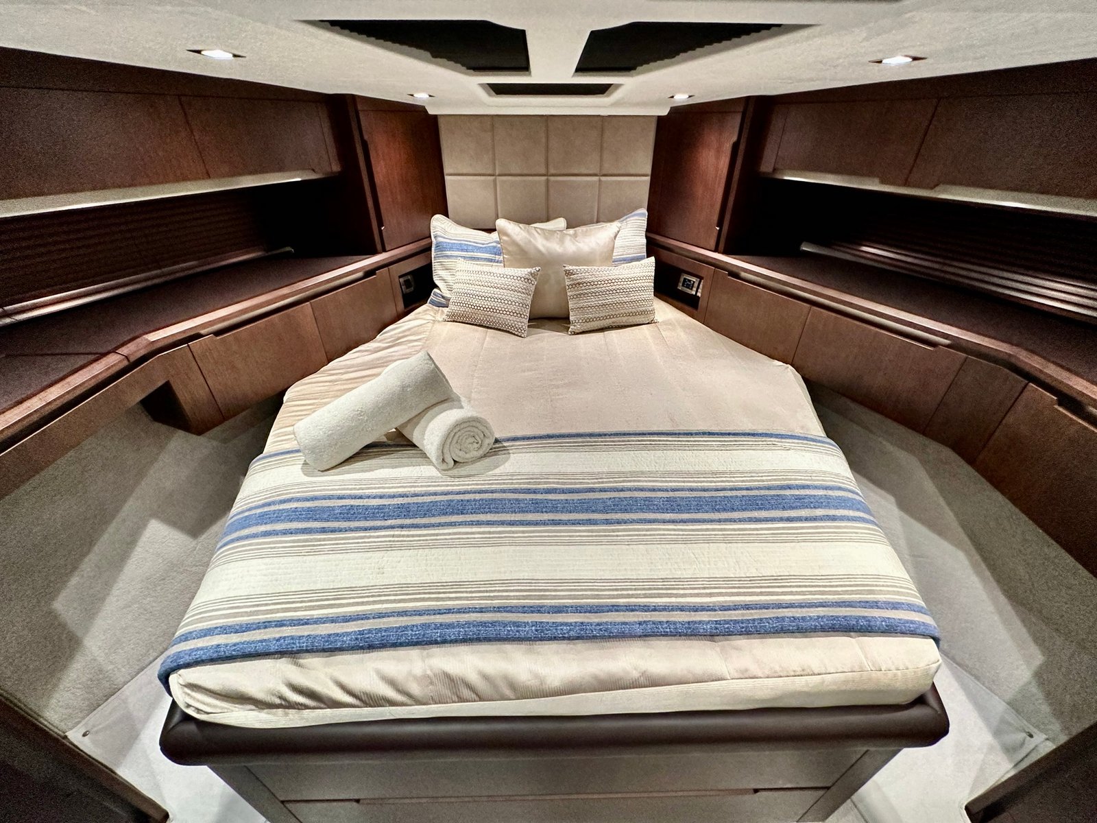 A guest stateroom with striped bedding